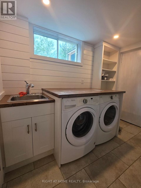A laundry room with a washer and dryer.