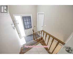 A staircase with a separate base ment entrance.