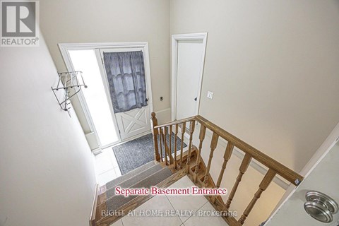 A staircase with a separate base ment entrance.