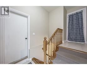 A room with a staircase leading to the second floor.