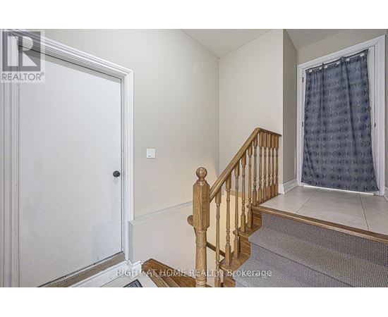 A room with a staircase leading to the second floor.