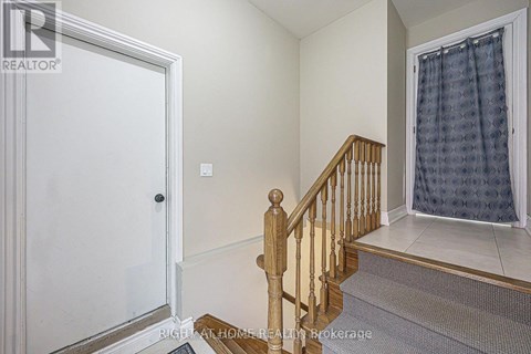 A room with a staircase leading to the second floor.