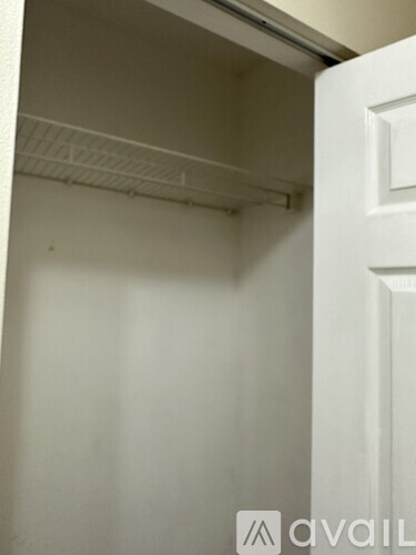 A white door with a white interior and a white wall.