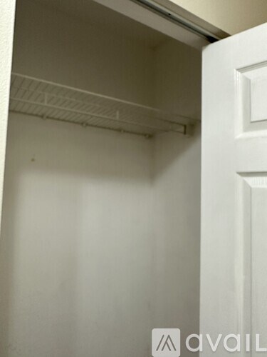 A white door with a white interior and a white wall.