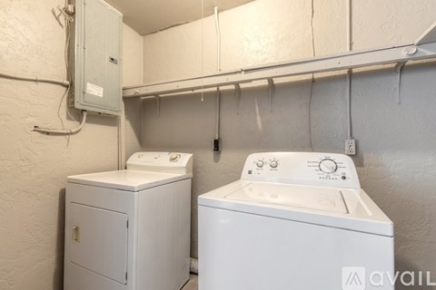 A washer and dryer in a laundry room.
