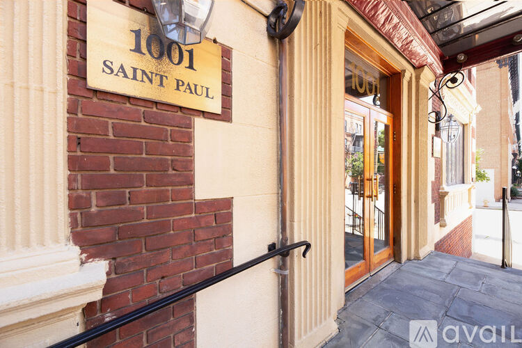 The image shows the front of a building with a sign that reads "1001 SAINT PAUL".