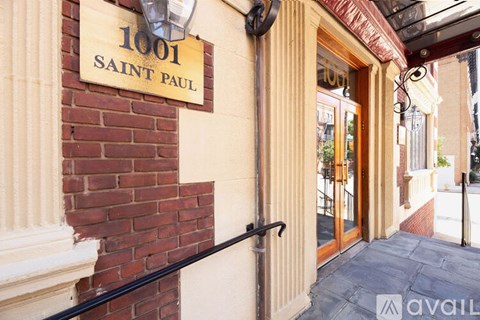 The image shows the front of a building with a sign that reads "1001 SAINT PAUL".
