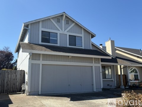 A two-car garage is attached to a house.