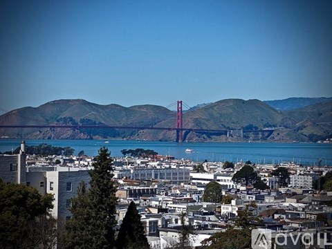 A cityscape with a bridge in the background.