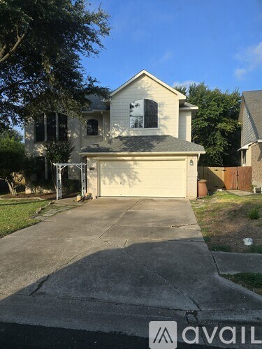 A house with a driveway in front of it.
