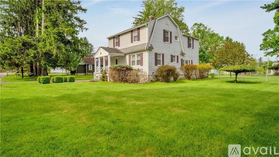 A house with a lawn in front of it is for sale.