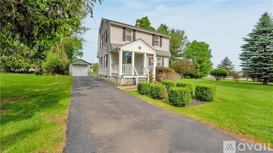 A house with a driveway in front of it.