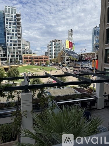 A view of a cityscape with a large open space in the foreground.