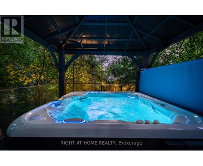 A hot tub in a covered patio area.