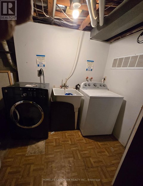 A laundry room with a washer and dryer.
