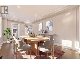 A dining room with a wooden table and chairs.