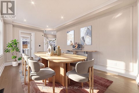 A dining room with a wooden table and chairs.