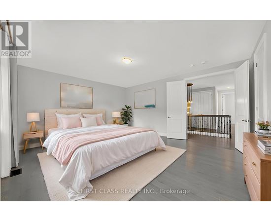 A bedroom with a large bed and a balcony.