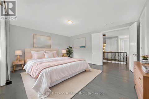 A bedroom with a large bed and a balcony.