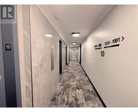 A long hallway with a sign that says REALTOR.