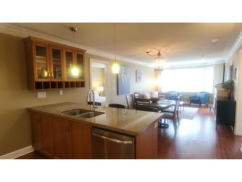 A kitchen with a sink and a counter.