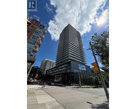 A tall building with many windows is in the center of the image.