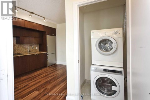 A realtor photo of a laundry room with a washer and dryer.