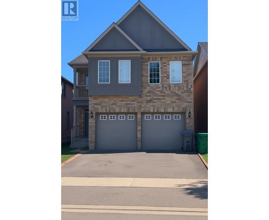 A two-story house with a garage and a driveway.