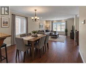 A dining room with a table set for six.