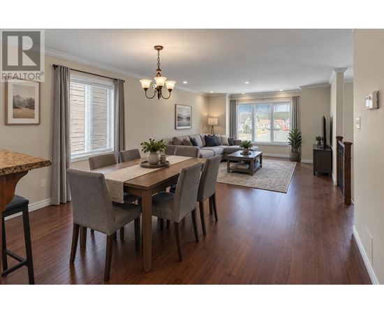 A dining room with a table set for six.