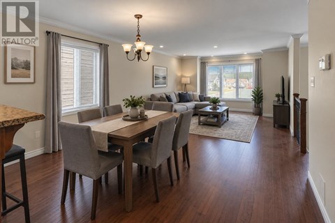 A dining room with a table set for six.