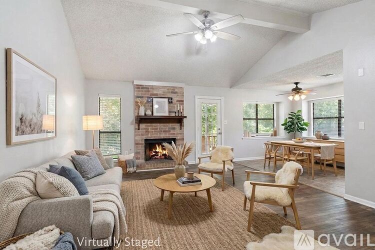 A living room with a fireplace and a couch.