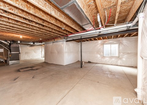 A room with a window covered in white insulation material.