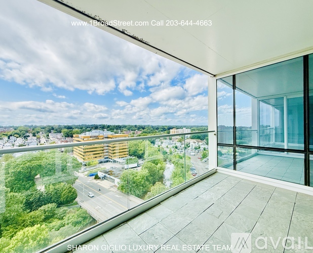 A real estate team is advertising a property with a view of a cityscape.