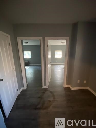 A room with a doorway leading to another room.
