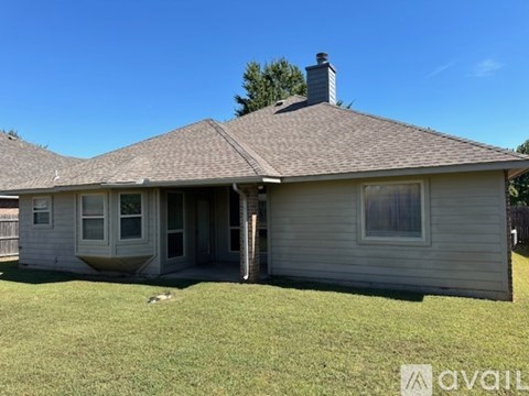 A house with a brown roof and a chimney is available for rent.
