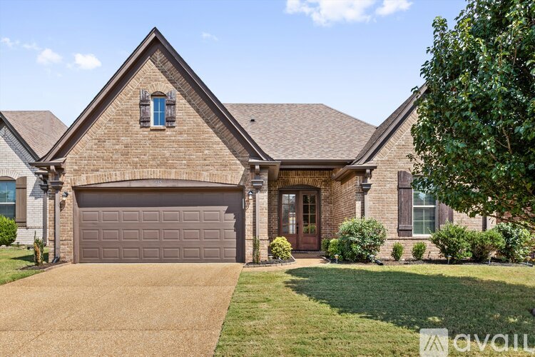 A house with a brown garage door and a brown front door.