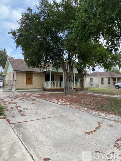 A house with a tree in front of it.