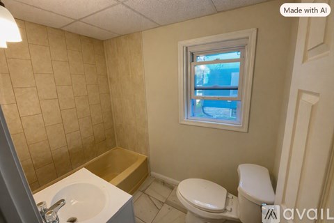 A bathroom with a toilet, sink, and window.