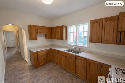 A kitchen with wooden cabinets and a sink.