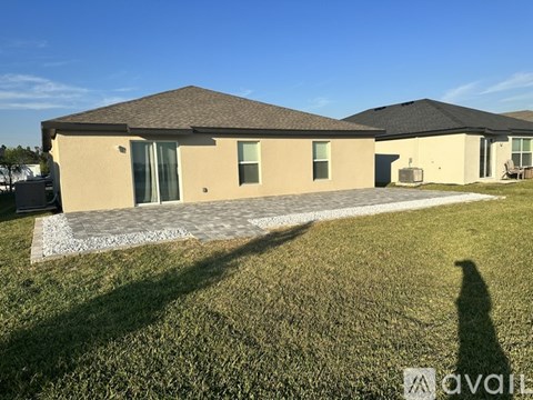 A house with a driveway in front of it.