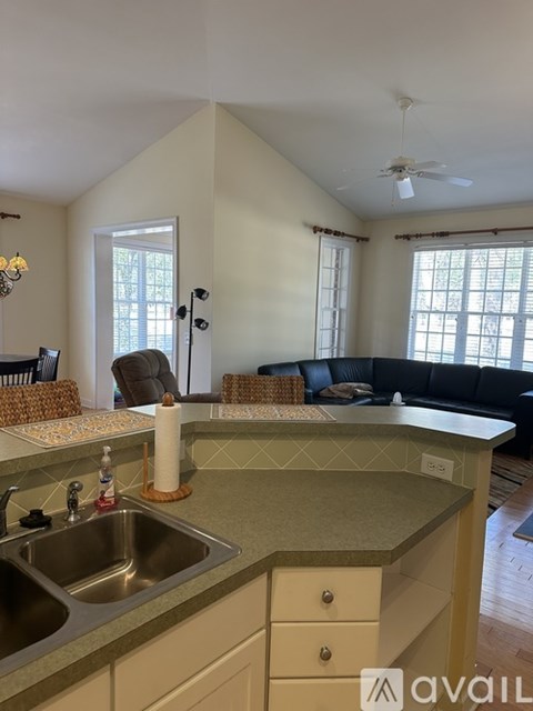 A kitchen with a sink and a counter.