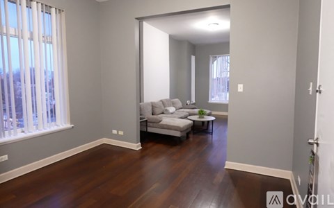 A living room with a couch and a coffee table.