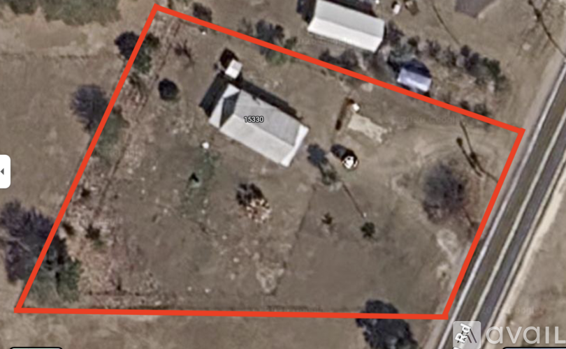 A satellite image shows a property with a house and a car.