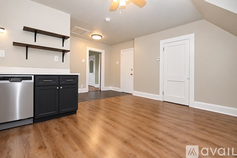 A kitchen with a dishwasher and a refrigerator.