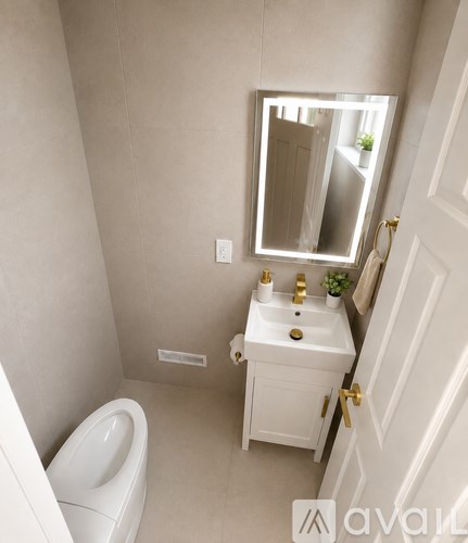 A bathroom with a toilet, sink, and mirror.