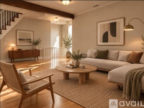 A living room with a wooden chair, a sofa, and a coffee table.