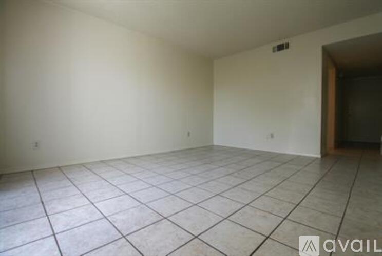 A room with white walls and a tiled floor.
