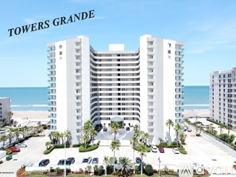 A large white building with the words "TOWERS GRANDE" on top of it.