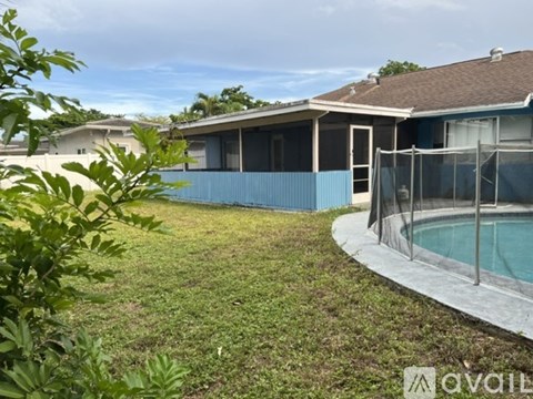 A house with a pool in the backyard.